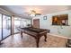 Entertaining game room with a billiards table, ceiling fan, and tile floors at 4739 Tierra Alta Ct, Lakeland, FL 33813