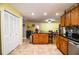 Spacious kitchen featuring an island, tile floors, and oak cabinetry at 4739 Tierra Alta Ct, Lakeland, FL 33813