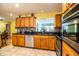 Kitchen with granite countertops, mosaic backsplash, and stainless steel appliances at 4739 Tierra Alta Ct, Lakeland, FL 33813