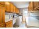 Functional laundry room with ample storage and a sink at 4739 Tierra Alta Ct, Lakeland, FL 33813