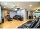 Comfortable living room with hardwood floors, ceiling fan and leather furniture at 4739 Tierra Alta Ct, Lakeland, FL 33813