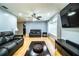 Cozy living room with hardwood floors, stylish furniture, and a large window providing ample natural light at 4739 Tierra Alta Ct, Lakeland, FL 33813