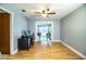 Office area with hardwood floors, ceiling fan, desk and a pool table in the background at 4739 Tierra Alta Ct, Lakeland, FL 33813