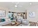 Bright and airy living room open to the kitchen, complete with stylish furniture and modern decor at 479 Pine Tree Blvd, Lake Alfred, FL 33850