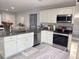 Kitchen view displaying granite countertops, stainless steel appliances, and white cabinetry at 15068 Sw 43Rd Ct, Ocala, FL 34473