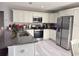 Kitchen showcasing stainless steel appliances, granite countertops, and ample cabinet space at 15068 Sw 43Rd Ct, Ocala, FL 34473