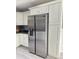 Kitchen featuring stainless steel refrigerator and white cabinets for maximum storage at 15068 Sw 43Rd Ct, Ocala, FL 34473