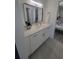 Bathroom featuring modern vanity with white cabinets and stone countertops at 1912 Providence Rd, Lakeland, FL 33805