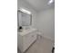 Bathroom featuring modern vanity with white cabinets and stone countertops at 1912 Providence Rd, Lakeland, FL 33805