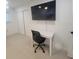 Bedroom featuring laminate floors, a closet, a desk and tv at 1912 Providence Rd, Lakeland, FL 33805