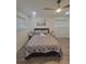 Bedroom featuring wood floors, a ceiling fan, and neutral color palette at 1912 Providence Rd, Lakeland, FL 33805