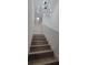 Stylish staircase featuring wood-look steps and modern lighting at 1912 Providence Rd, Lakeland, FL 33805