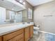 Bathroom featuring vanity with sink, commode, shower, and bathtub at 2448 Brownwood Dr, Mulberry, FL 33860