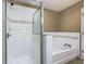 Bathtub and shower combination with tile surround at 2448 Brownwood Dr, Mulberry, FL 33860