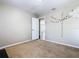 Neutral bedroom featuring carpeted floors, light-colored walls, and an open doorway to the home's interior at 2448 Brownwood Dr, Mulberry, FL 33860