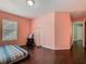 Bedroom featuring dark wood floors, a window, and walk-in closet at 2448 Brownwood Dr, Mulberry, FL 33860