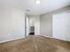 Bedroom featuring tan carpet and a large closet at 2448 Brownwood Dr, Mulberry, FL 33860