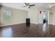 Large bedroom with hardwood floors, ceiling fan, closet, and neutral paint at 2448 Brownwood Dr, Mulberry, FL 33860