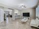 Spacious living room featuring tile flooring, a ceiling fan, and neutral wall colors at 2448 Brownwood Dr, Mulberry, FL 33860