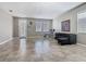 Bright living room featuring a large window, tile flooring, and neutral walls at 2448 Brownwood Dr, Mulberry, FL 33860