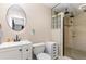 Contemporary bathroom with a vessel sink, framed mirror, and tiled walk-in shower at 800 22Nd Nw St, Winter Haven, FL 33881