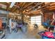 Spacious garage with exposed wood beams, organized shelving, and ample workspace for projects and storage at 800 22Nd Nw St, Winter Haven, FL 33881