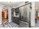 Contemporary kitchen with stainless steel refrigerator and dark cabinets at 800 22Nd Nw St, Winter Haven, FL 33881