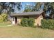 A small home outbuilding provides extra space and functionality with an open door and easy access at 800 22Nd Nw St, Winter Haven, FL 33881