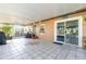 Enclosed patio with tile flooring leading to an inviting swimming pool through a sliding glass door at 800 22Nd Nw St, Winter Haven, FL 33881