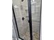 Modern walk-in shower with pebble floor, glass enclosure, and white tiled walls at 1264 Buckeye Ne Rd, Winter Haven, FL 33881