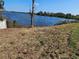 Scenic view of the waterfront with a clear blue sky providing a serene backdrop for the lake at 1264 Buckeye Ne Rd, Winter Haven, FL 33881