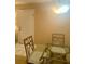 Casual dining area with a glass-top table and view of the front door at 101 Bent Tree Dr # 12, Daytona Beach, FL 32114