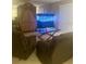 Relaxing living room with recliner chairs, entertainment center, and fish tank at 101 Bent Tree Dr # 12, Daytona Beach, FL 32114