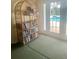 Relaxing room with a bookshelf filled with books and pool view at 101 Bent Tree Dr # 12, Daytona Beach, FL 32114