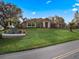 Beautifully landscaped front yard and well-maintained lawn of a single-story home at 12538 Lake View Ln, Clermont, FL 34711