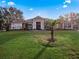 Charming single-story home featuring a well-manicured lawn and a welcoming front entrance at 12538 Lake View Ln, Clermont, FL 34711