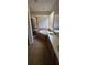 Bathroom featuring a bathtub, glass shower, tile floors, and bright natural light from the window at 315 Villa Sorrento Cir, Haines City, FL 33844