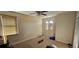 Neutral bedroom featuring a ceiling fan, two windows with blinds, and carpet flooring at 315 Villa Sorrento Cir, Haines City, FL 33844