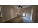 Bedroom featuring multiple windows and a door to a balcony at 315 Villa Sorrento Cir, Haines City, FL 33844