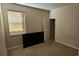 Bedroom with window, tan carpet, neutral paint, and closet at 315 Villa Sorrento Cir, Haines City, FL 33844