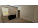 Bedroom with window, tan carpet, neutral paint, and closet at 315 Villa Sorrento Cir, Haines City, FL 33844