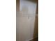 Neutral closet with tan carpet and closet rack with metal bar for hanging clothing at 315 Villa Sorrento Cir, Haines City, FL 33844