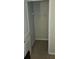 Neutral closet with tan carpet and closet rack with metal bar for hanging clothing at 315 Villa Sorrento Cir, Haines City, FL 33844