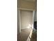 An empty walk-in closet with carpet and a white wire shelving unit at 315 Villa Sorrento Cir, Haines City, FL 33844