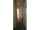 Hallway showing carpet, neutral paint, and multiple rooms in the home at 315 Villa Sorrento Cir, Haines City, FL 33844