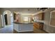 Bright kitchen with tiled floors, wood cabinets, and a breakfast bar at 315 Villa Sorrento Cir, Haines City, FL 33844
