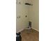 This is a laundry room with tile flooring, a shelf, and an opening for a dryer vent at 315 Villa Sorrento Cir, Haines City, FL 33844