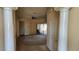 Spacious living room with tile and carpet flooring, leading to sliding glass doors at 315 Villa Sorrento Cir, Haines City, FL 33844