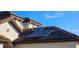 Roof detail showing solar panels on a terracotta tile roof, capturing sustainable energy for the modern home at 315 Villa Sorrento Cir, Haines City, FL 33844
