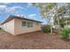 Exterior view of the home's backyard with a well-maintained lawn and mature landscaping at 1176 Balfour Dr, Deltona, FL 32725